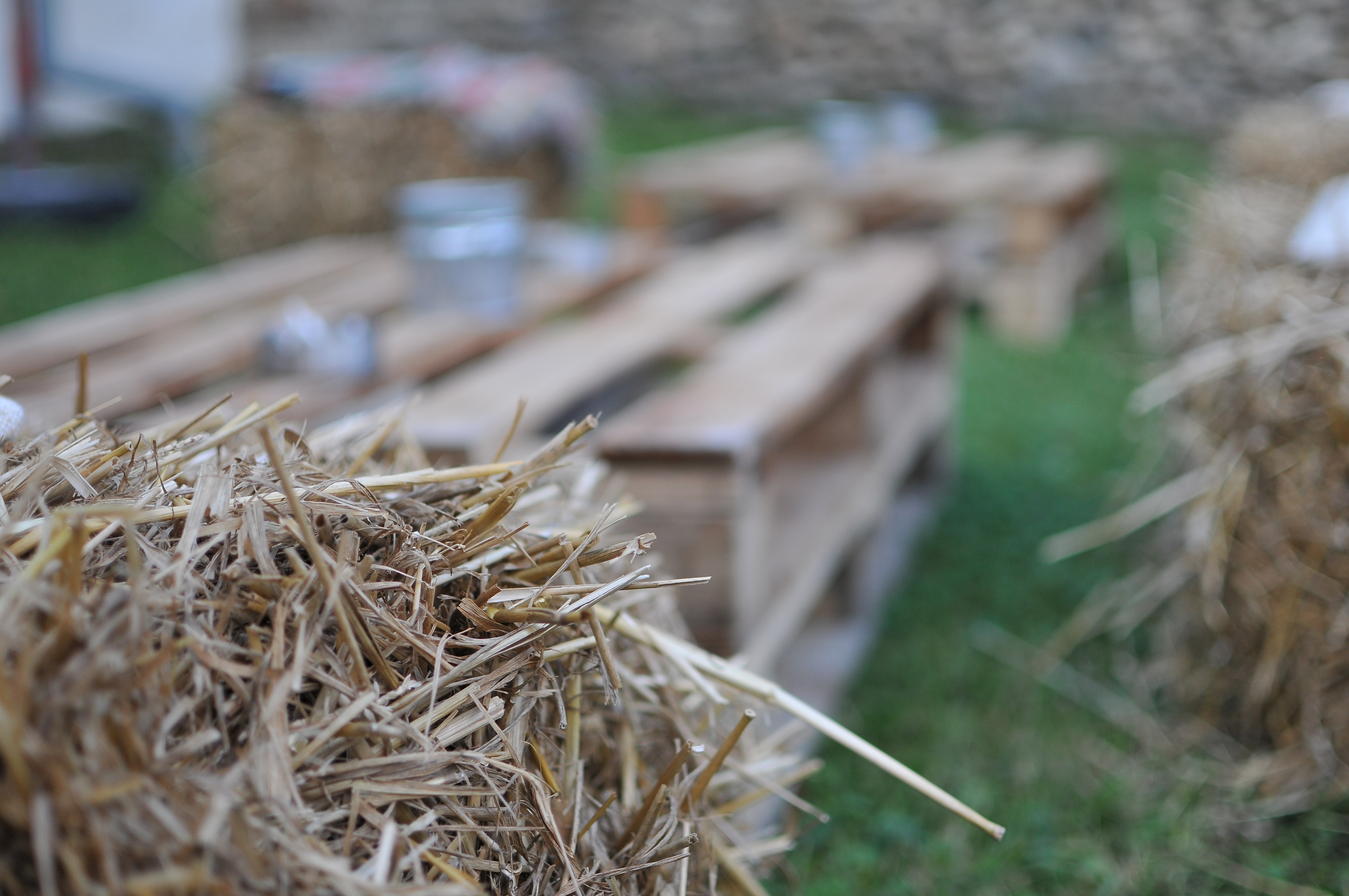 Hay stacks and wooden pallets for the outside area